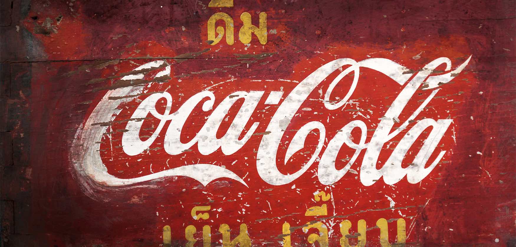 A close up of the coca cola logo
