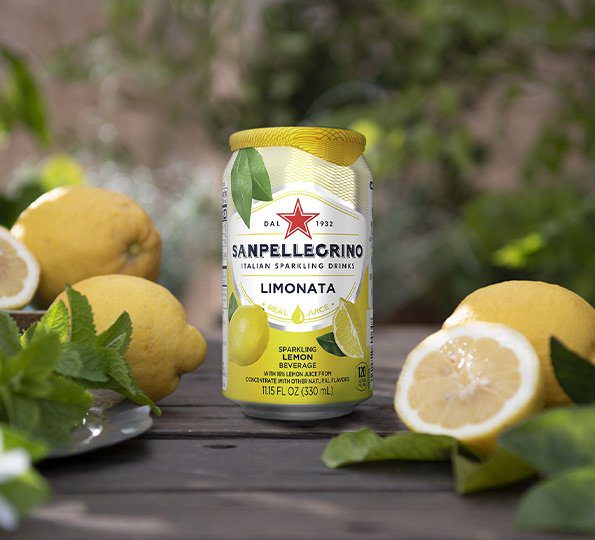 A can of san pellegrino lemonade sitting on top of a table.