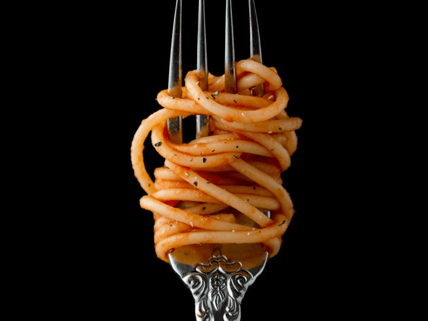 A fork with some pasta on it